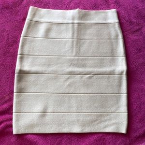 Bebe zip back bodycon skirt above the knee tan size small